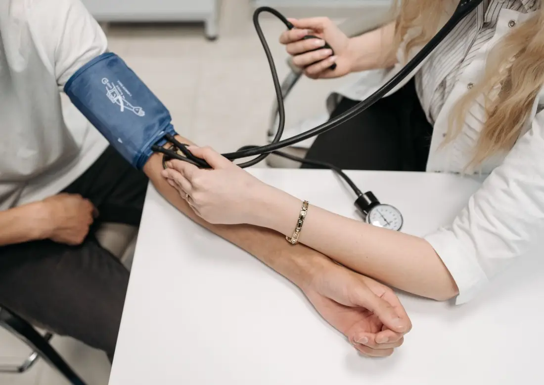 Blood pressure check during a physician consultation